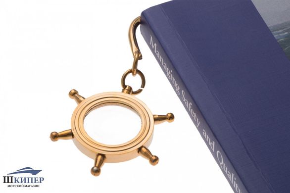 Bookmark with magnifying glass in the shape of steering wheel