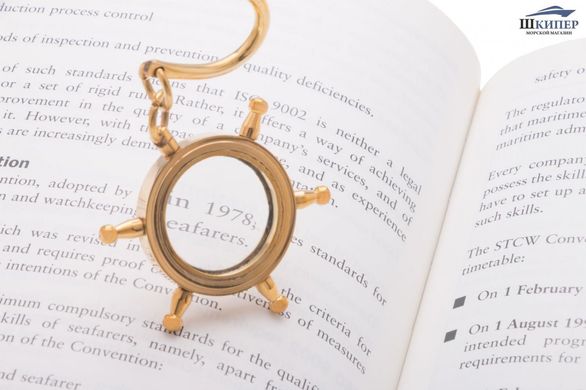 Bookmark with magnifying glass in the shape of steering wheel